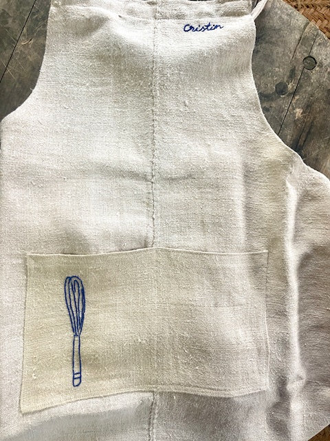 White &embroidery stitched Apron II.
