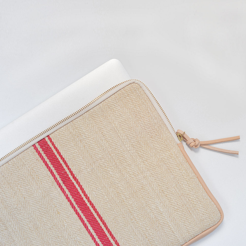 MacBook cover handcrafted  from a 100 years old grain sack and Spanish leather .