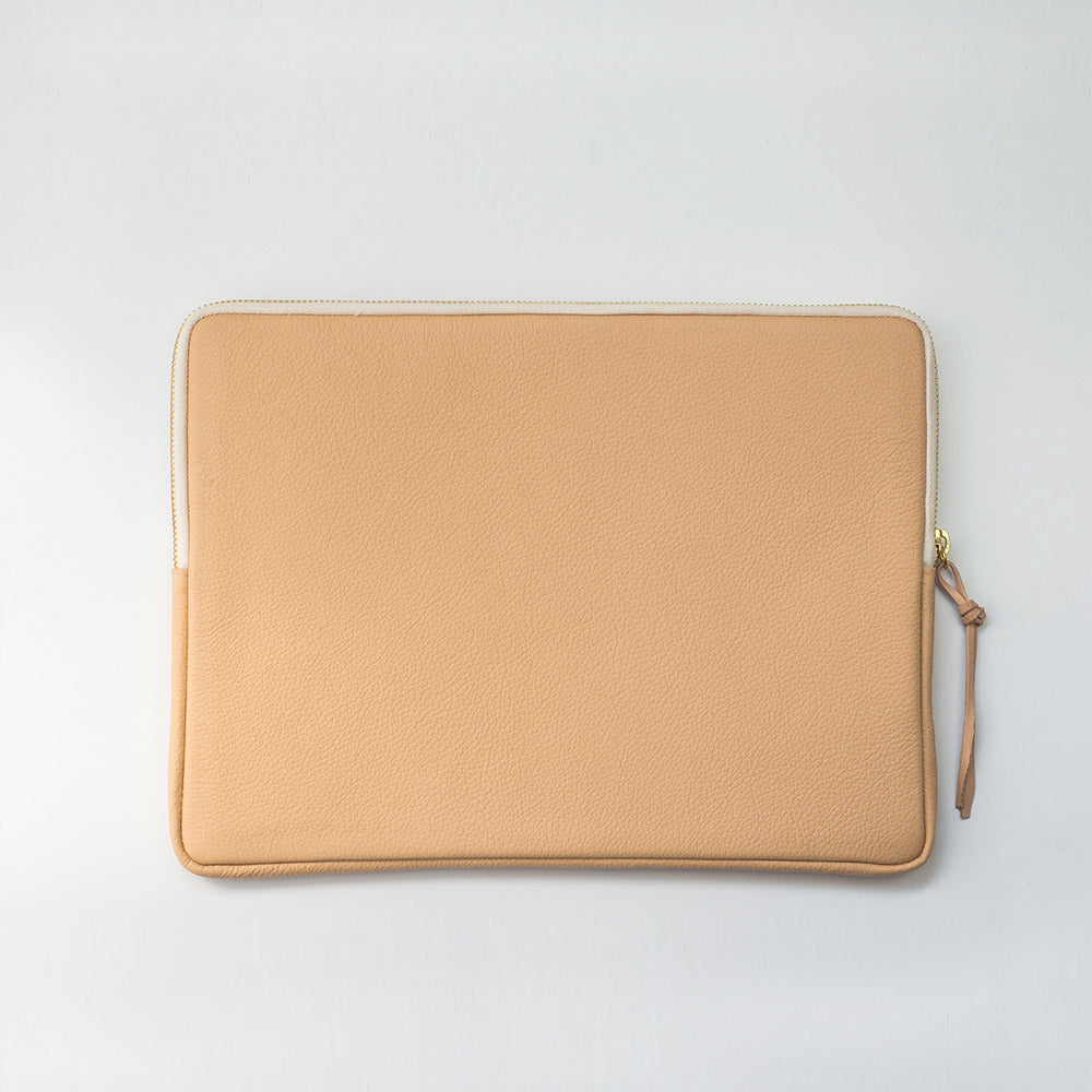 MacBook cover handcrafted  from a 100 years old grain sack and Spanish leather .